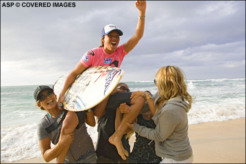 Hawaiian Melanie Bartels is given the traditional victory hoist after she clinched the Roxy Pro title at Sunset Beach. Picture credit ASP Tostee