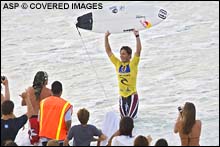 Andy Irons claims his victory after he scored an excellent 9.87 (out of a possible ten points) followed by a perfect 10 point ride to win the Rip Curl Pro Pipeline Masters and the Vans Triple Crown of Surfing simultaneously. PIc Credit ASP Tostee