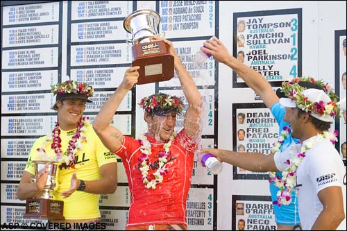 Joel Parkinson (Coolangatta, Gold Coast, Aus) is given the victory shower by fellow finalists Andy Irons (Haw) and Fred Patacchia (Haw) at the prize giving of the ONeill World Cup Pic Credit ASP Tostee